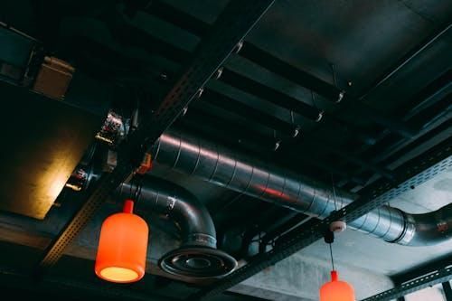 Detailed view of indoor air ducts on a ceiling in a modern interior.