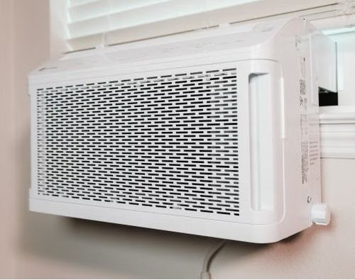 An image shows a wall-mounted air conditioner inside a house.