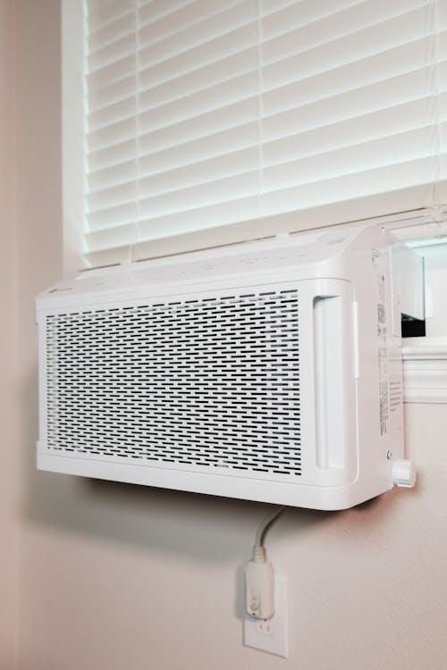 window air conditioning unit installed for residential cooling and airflow
