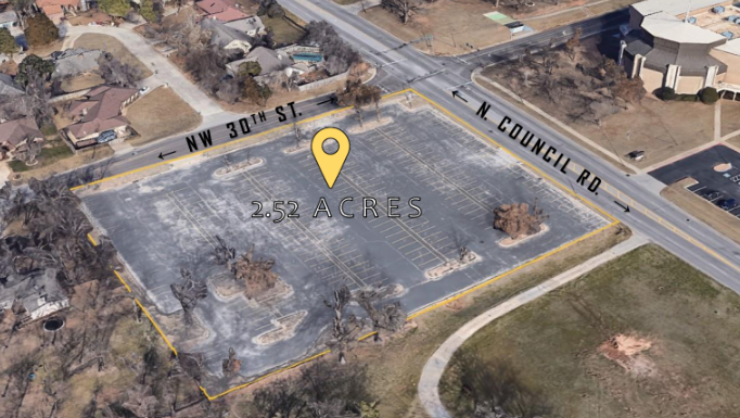 An aerial view of a lot with a yellow pin on it.