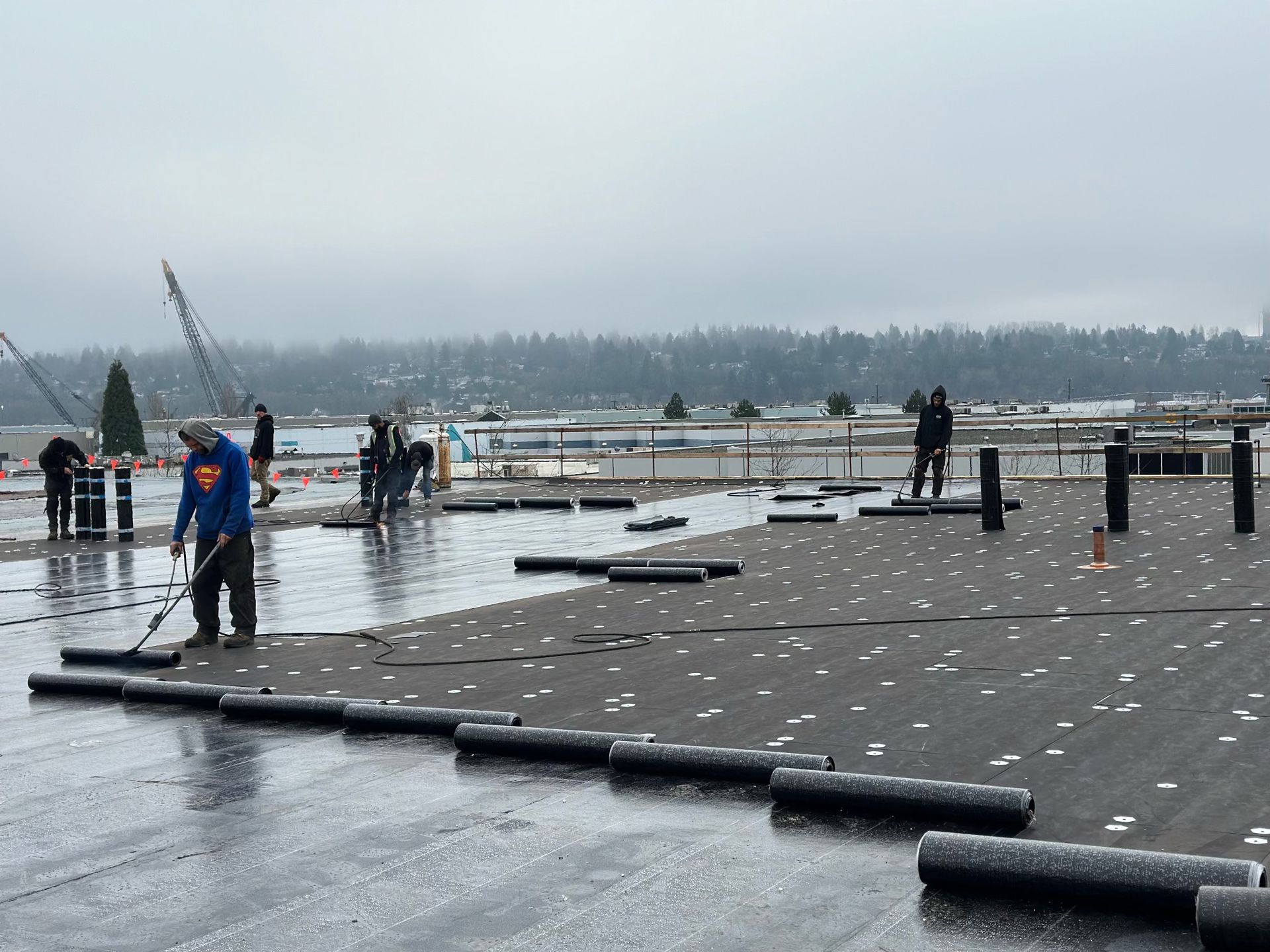 men are working on a roof