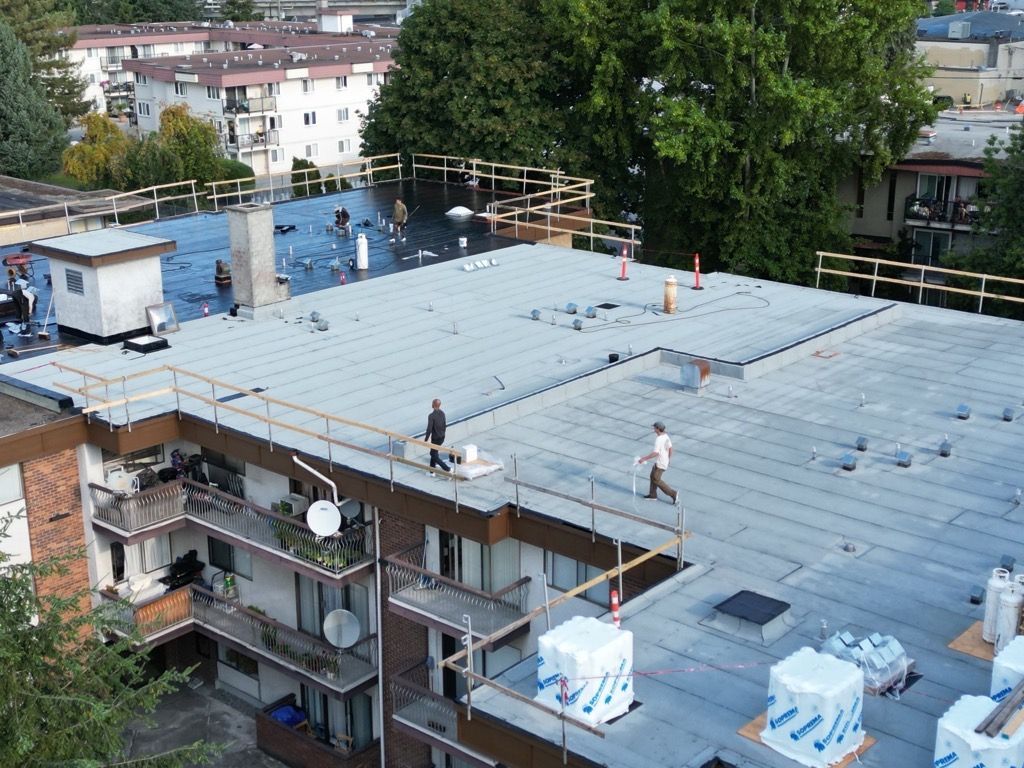 A man is walking on the roof of a building.