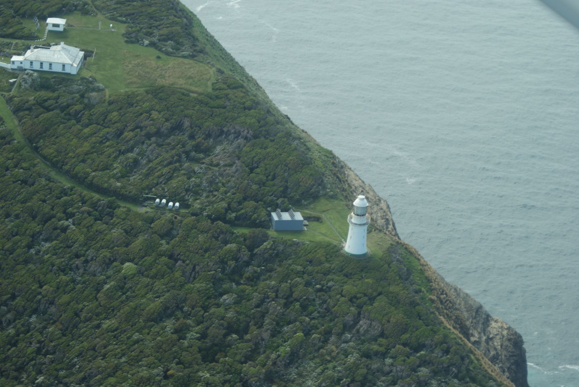 An aerial view of a beach and ocean waves.