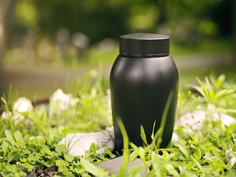 a black cremation urn after a simple cremation