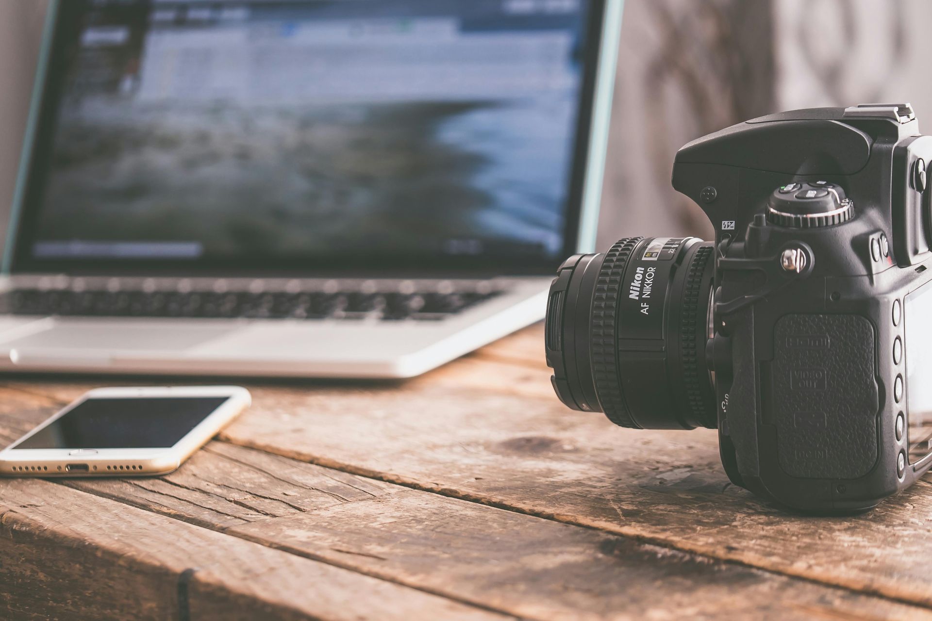 a laptop and camera used for tribute videos for a funeral service
