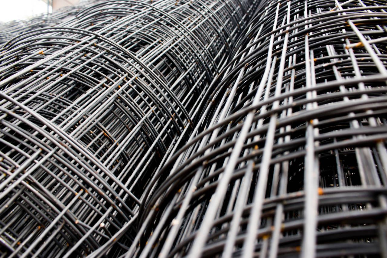 Rolls of black wire mesh.