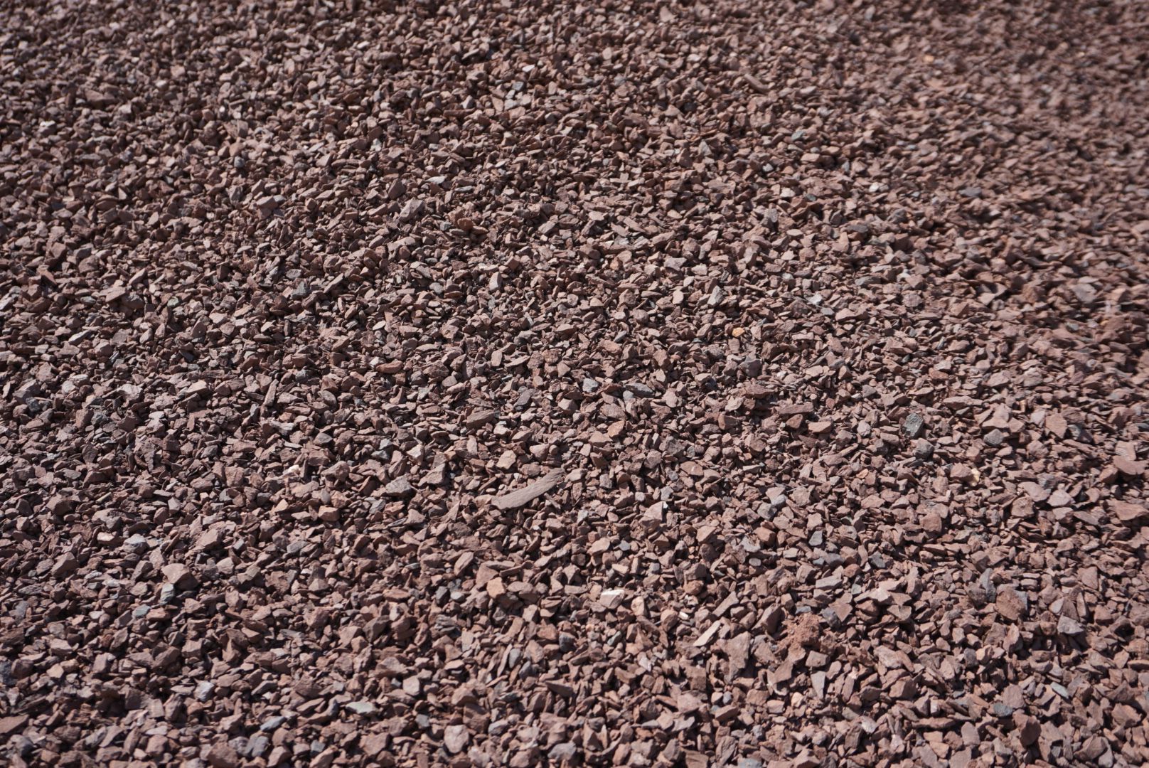 Pile of small brown rocks covering the ground.