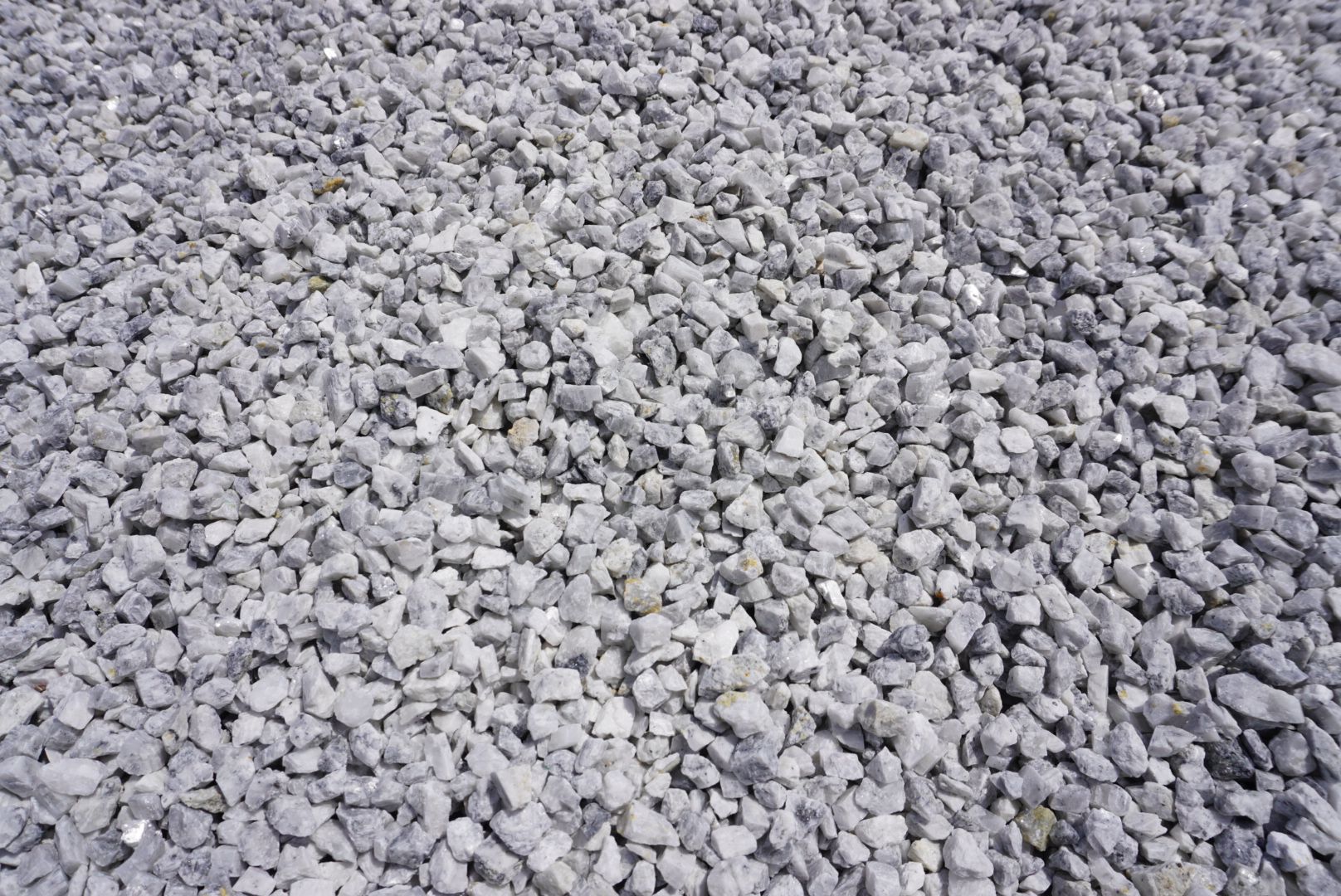 Close-up of light gray gravel stones covering the ground