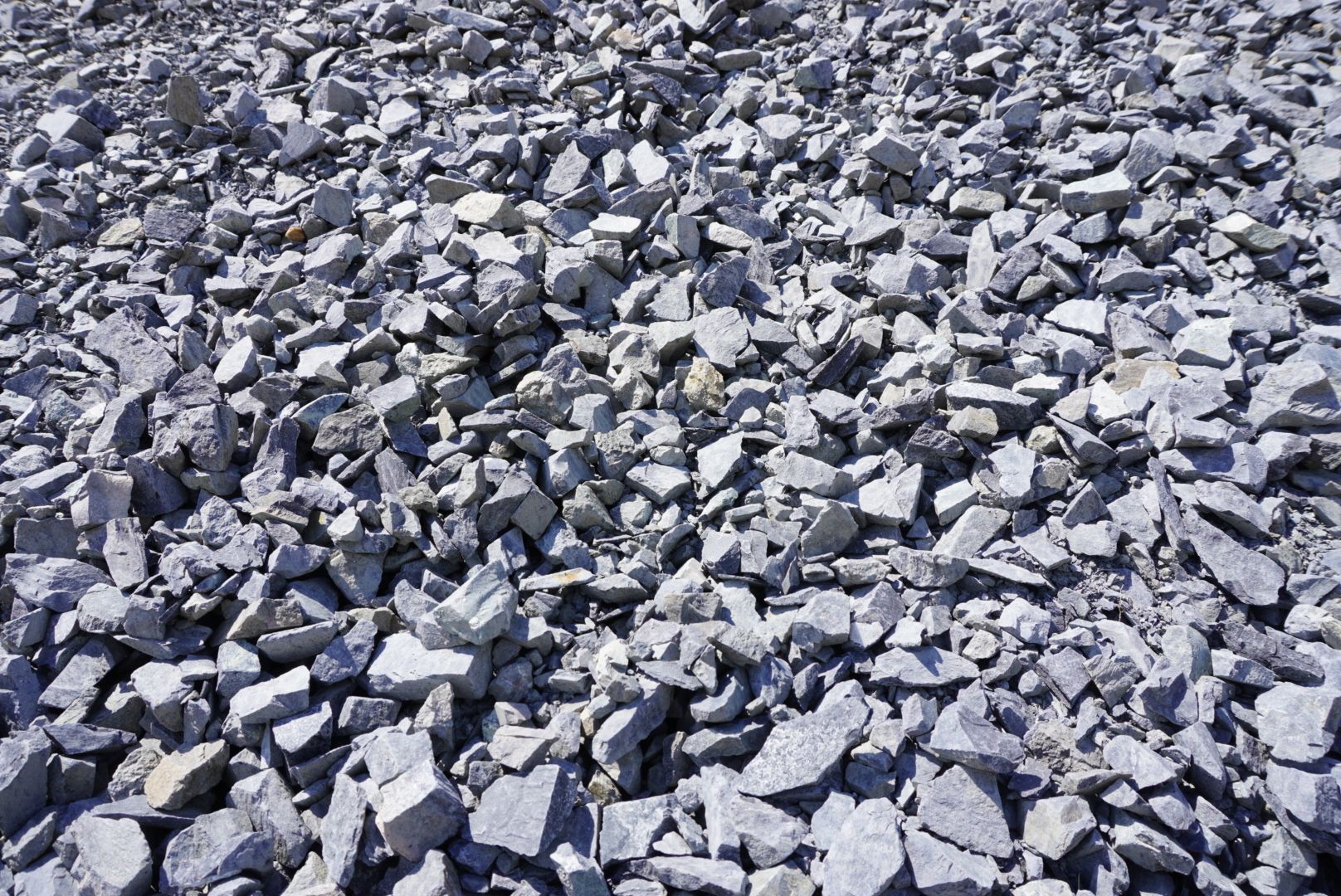 Piled gray rocks and rubble filling the frame