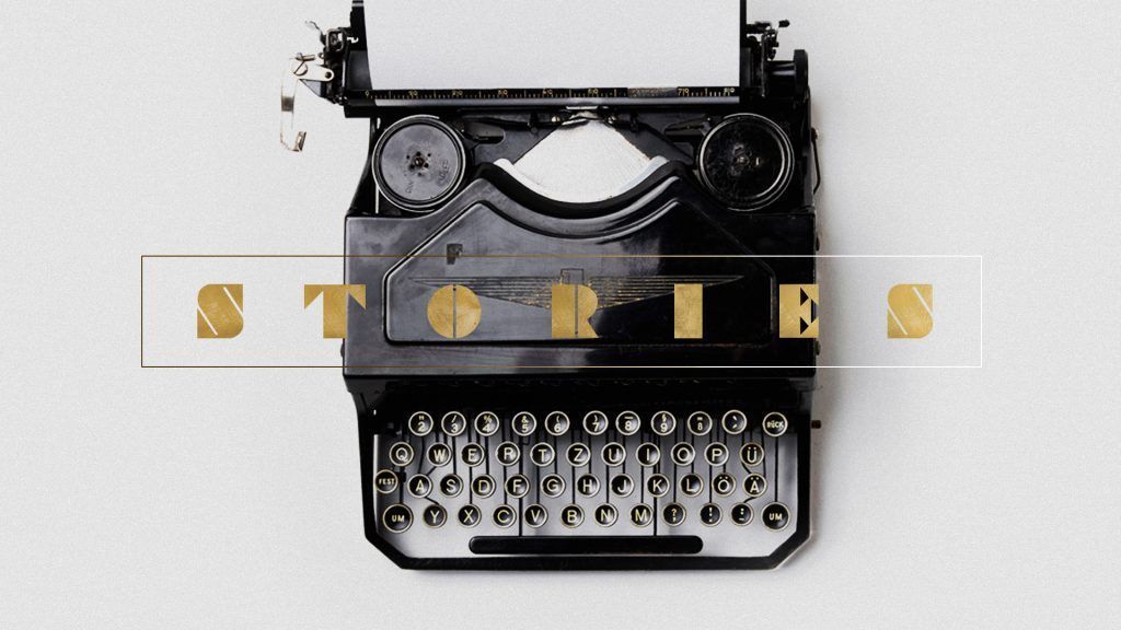 An old typewriter with the word stories written on it