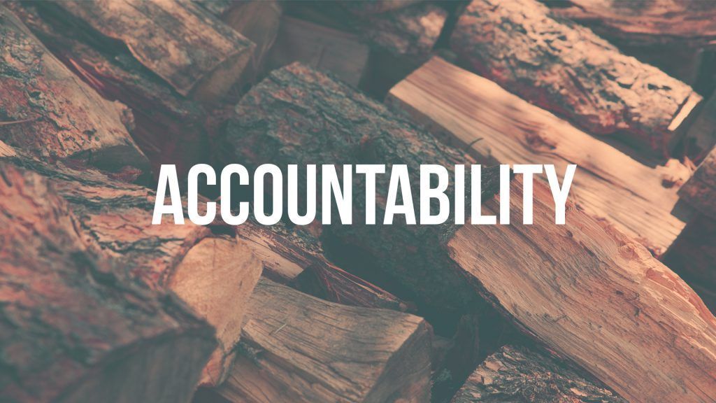 A pile of logs with the word accountability written on it.