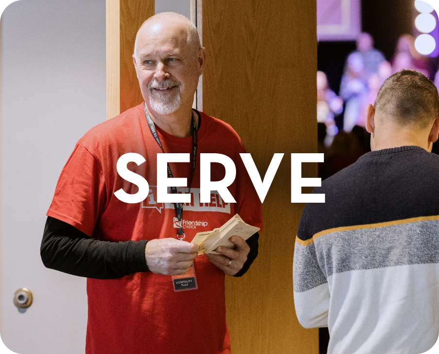 A man in a red shirt with the word serve on it