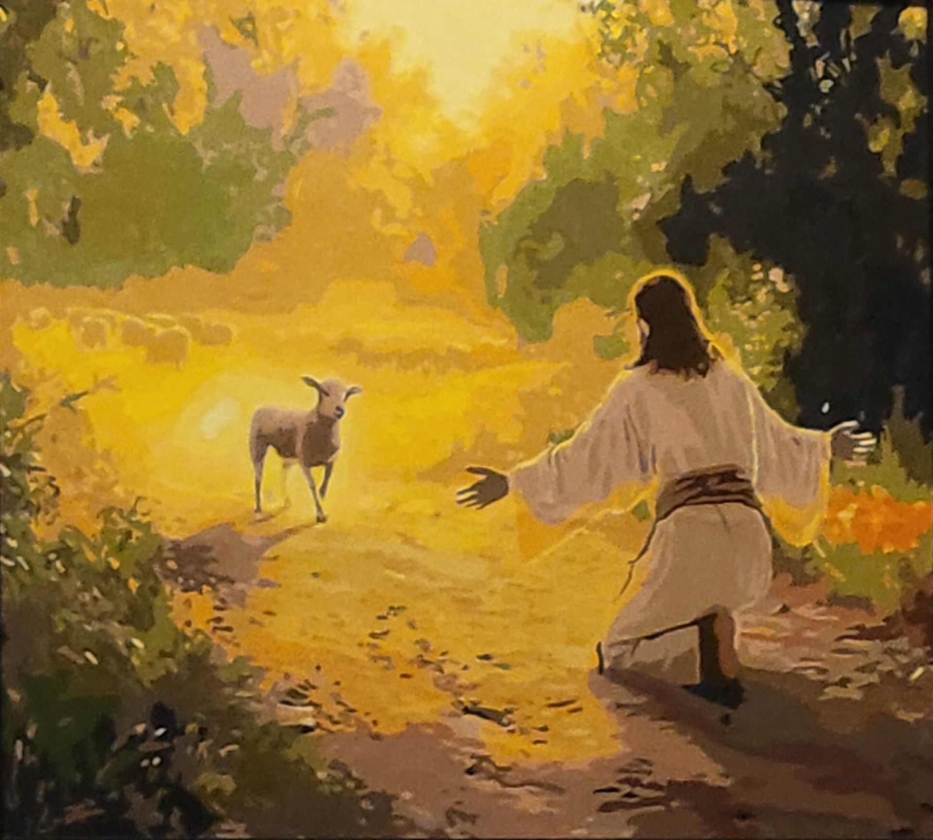 A figure in a white robe kneels with arms outstretched toward a lamb in a sunlit, golden, wooded path.