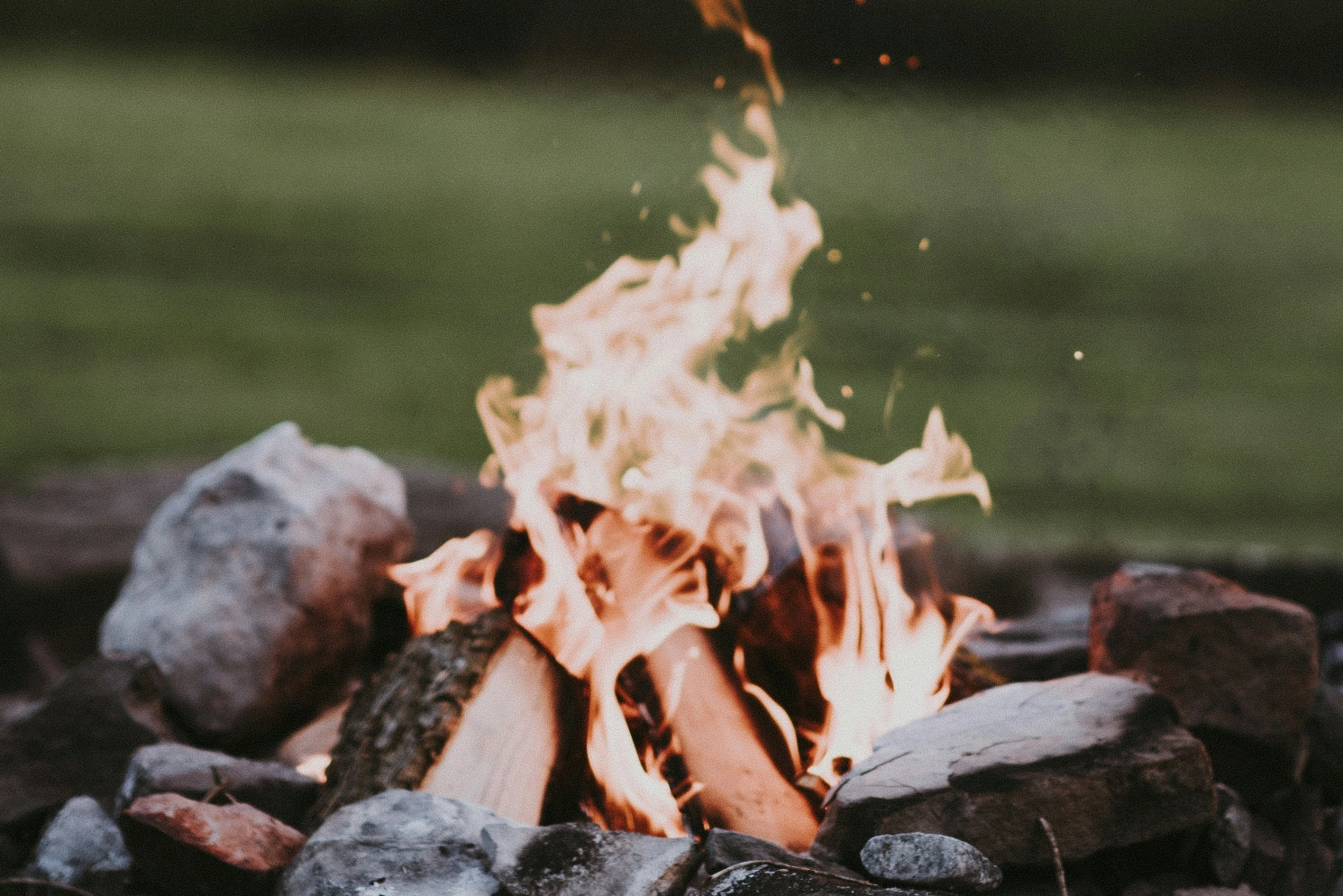 An outdoor fire put with a burning fire