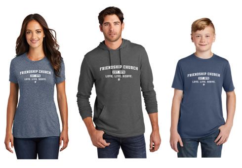 A woman a man and a boy are wearing matching shirts