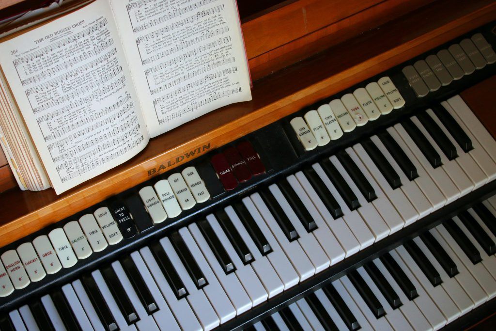 A piano keyboard with a book on top of it