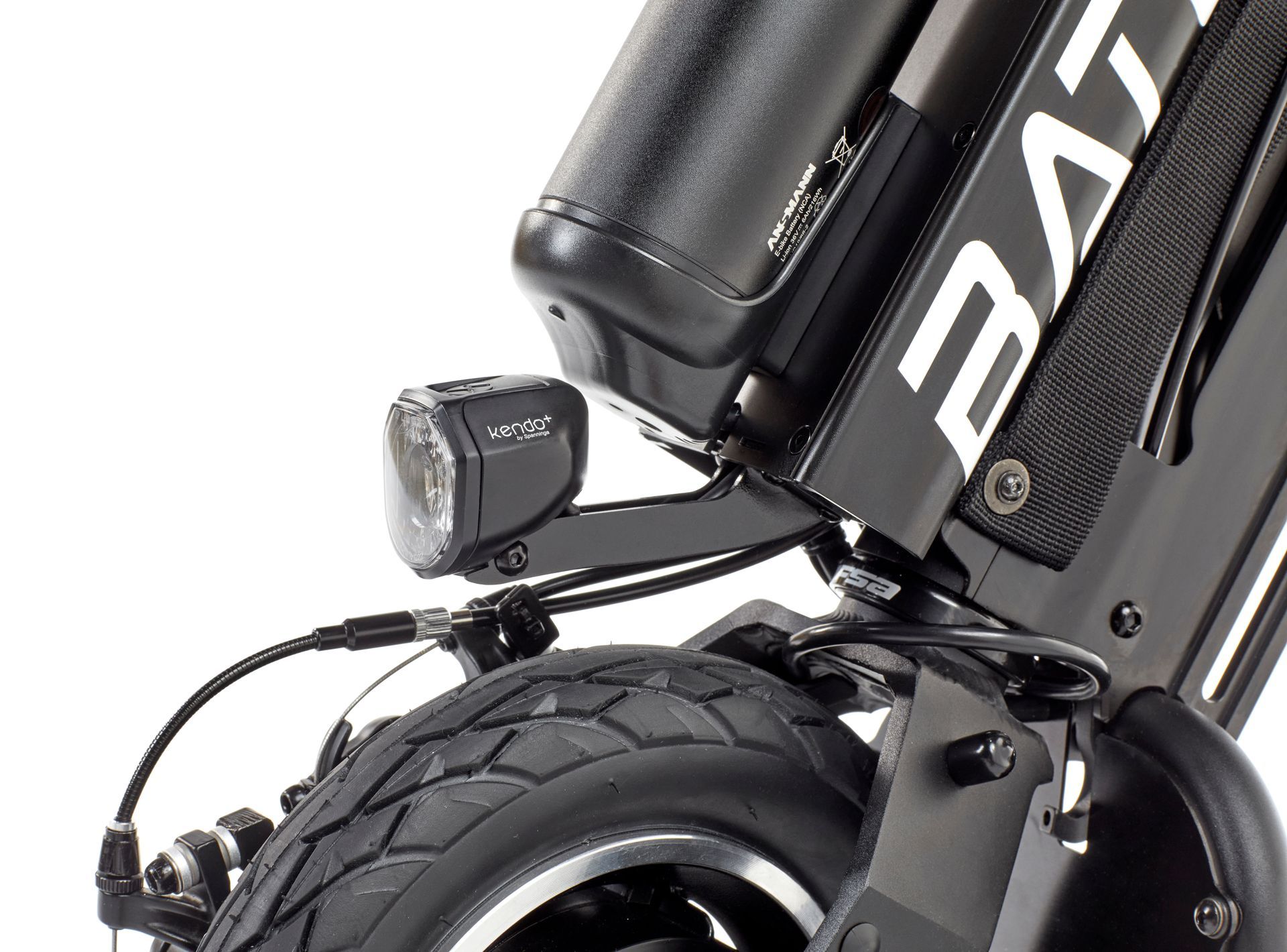 Close-up of a black electric bike’s rear wheel, motor, and mounted rear light.