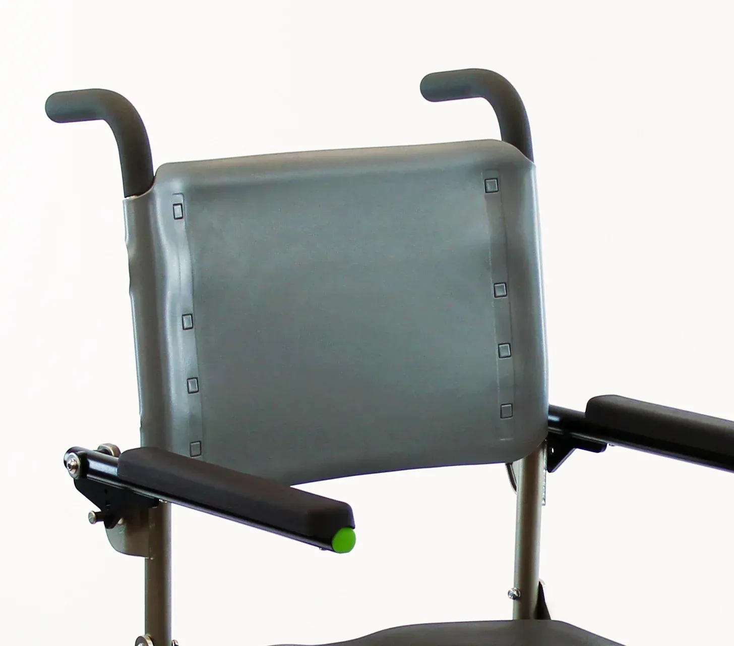 Back of a gray wheelchair with armrests and handles.