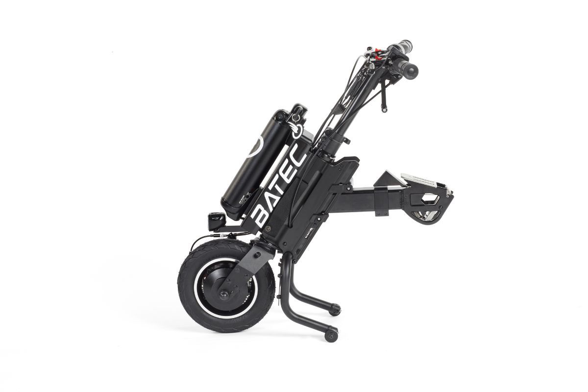 Black Batec handbike, folded, side view. Has battery pack and handlebar controls.