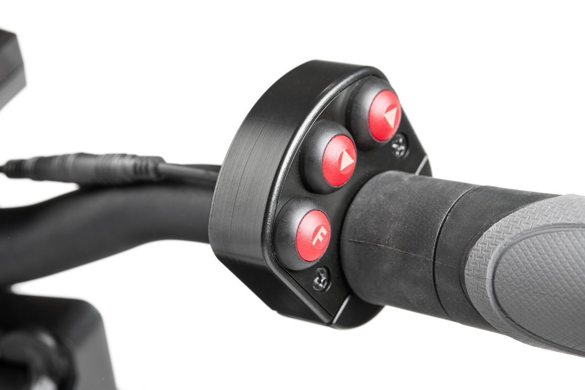 Black handlebar with red button controls for a scooter or similar device.