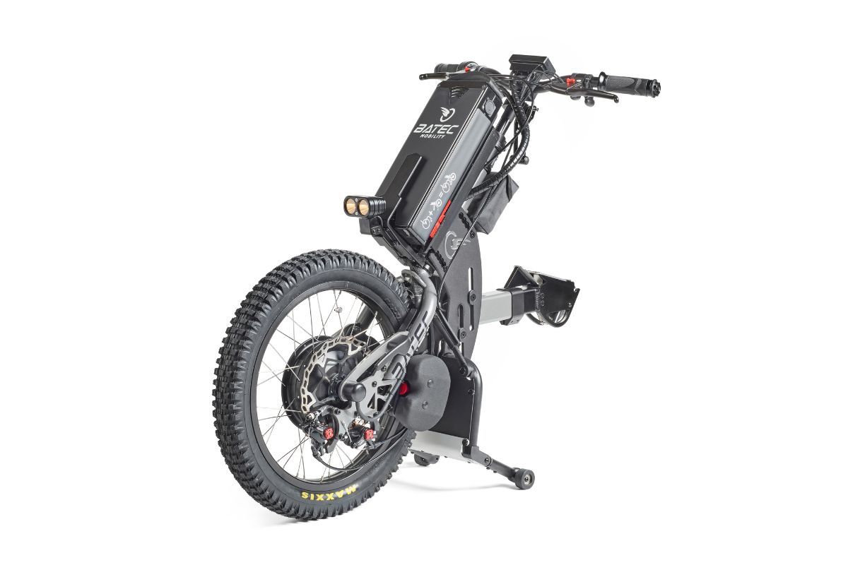 Black electric off-road wheelchair with large rear wheel.