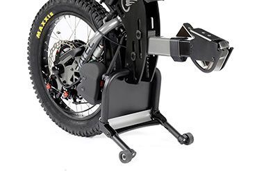 Black motorcycle rear wheel mounted on a black motorcycle lift stand with wheels.