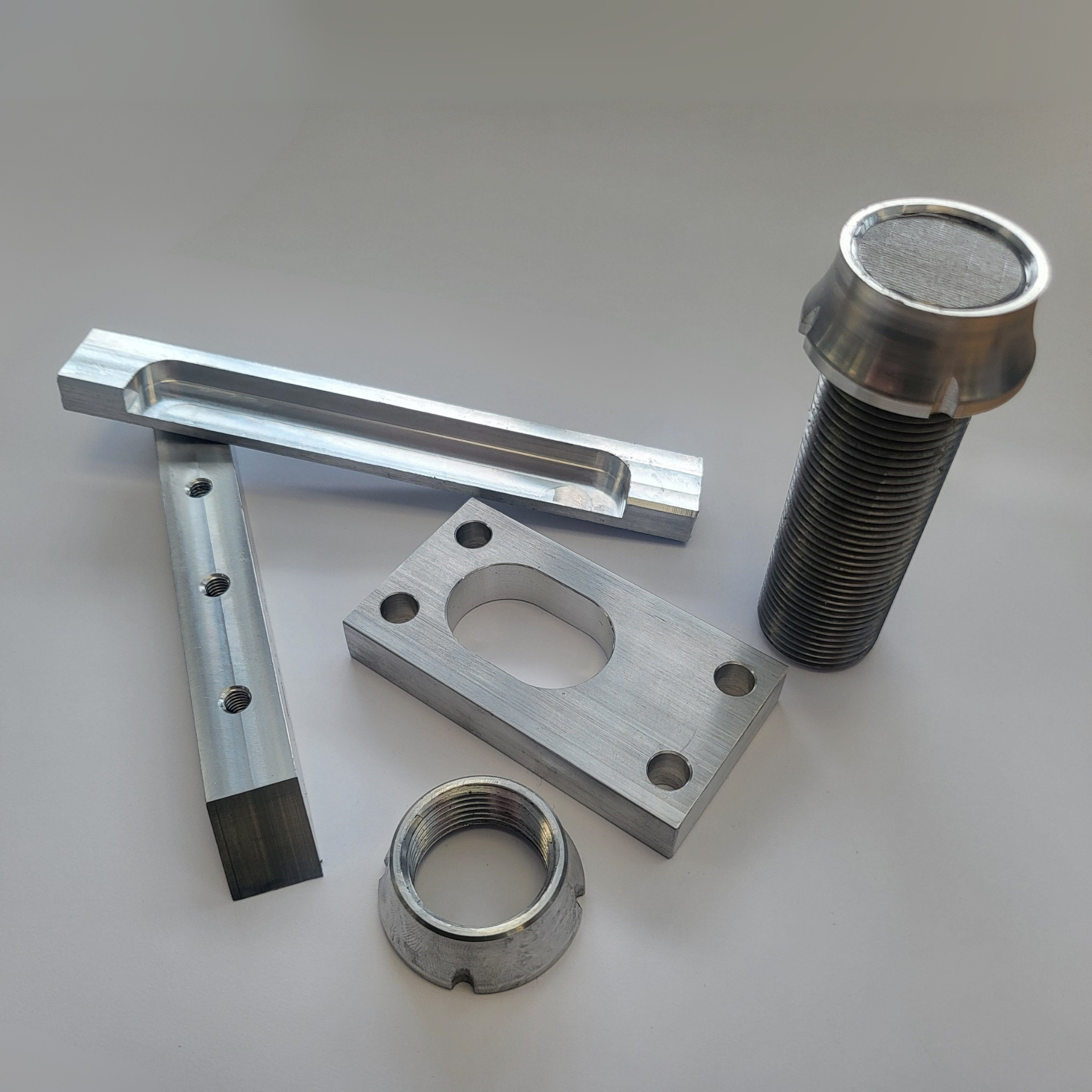A bunch of metal parts are sitting on a table