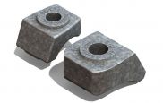 A pair of metal blocks with holes in them on a white background.