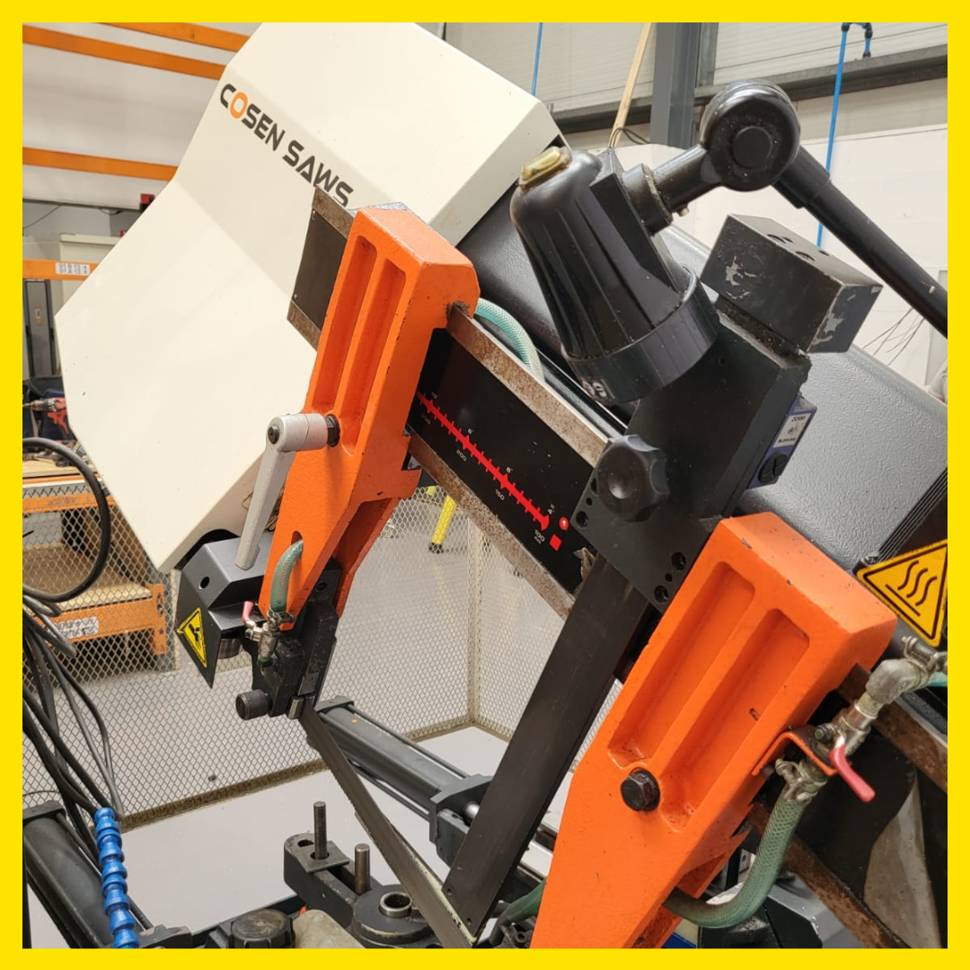 A close up of a cosen saw in a factory