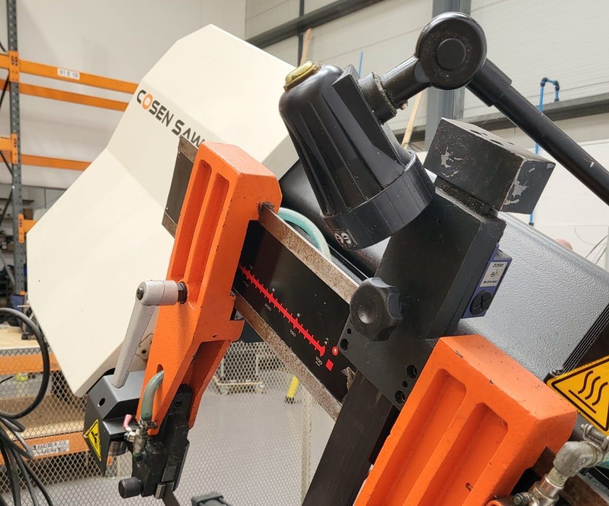 A close up of a machine with the word coen on it
