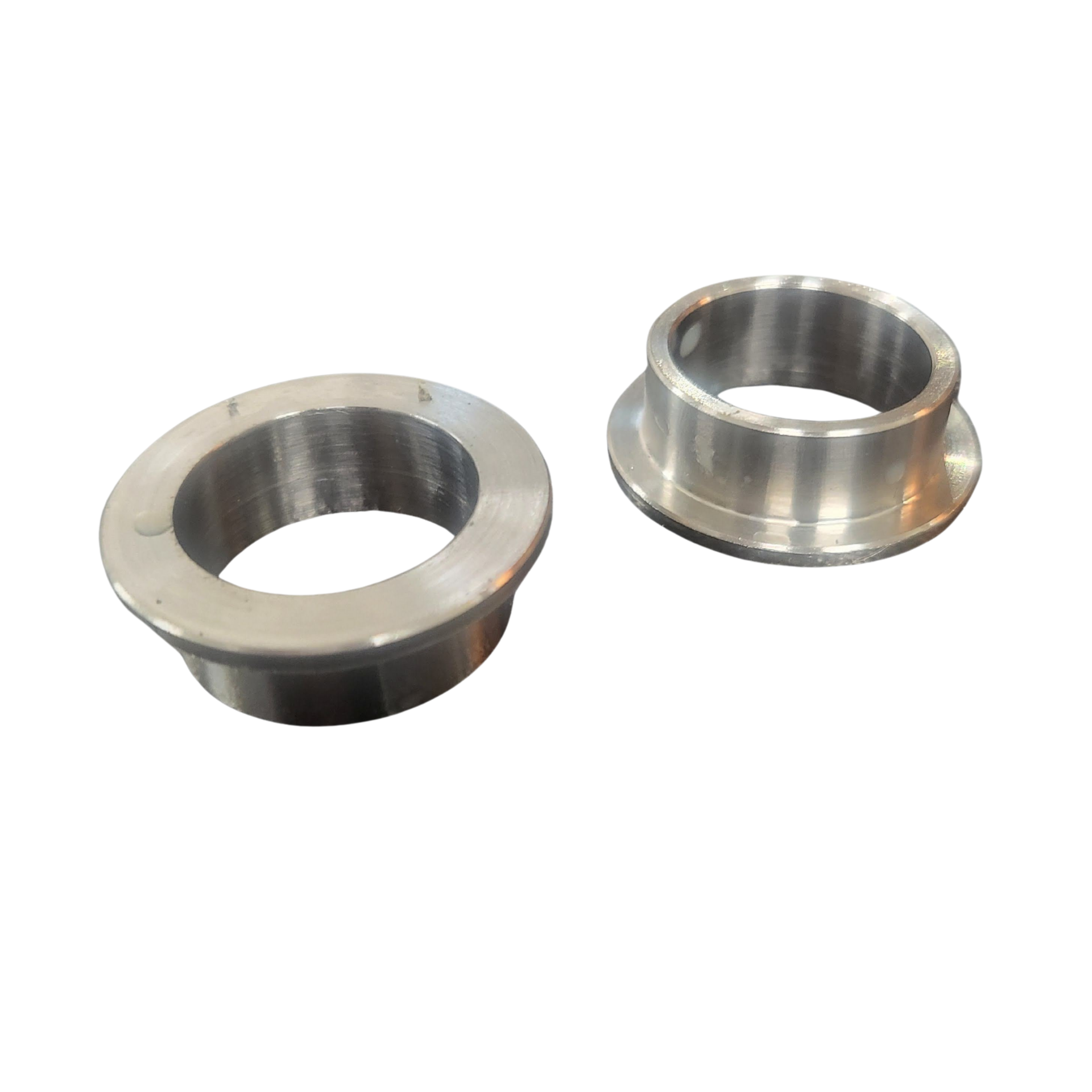 Two metal rings are sitting next to each other on a white background.