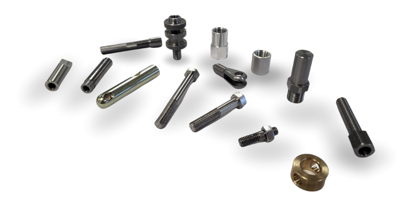 There are many different types of screws and nuts on the table.