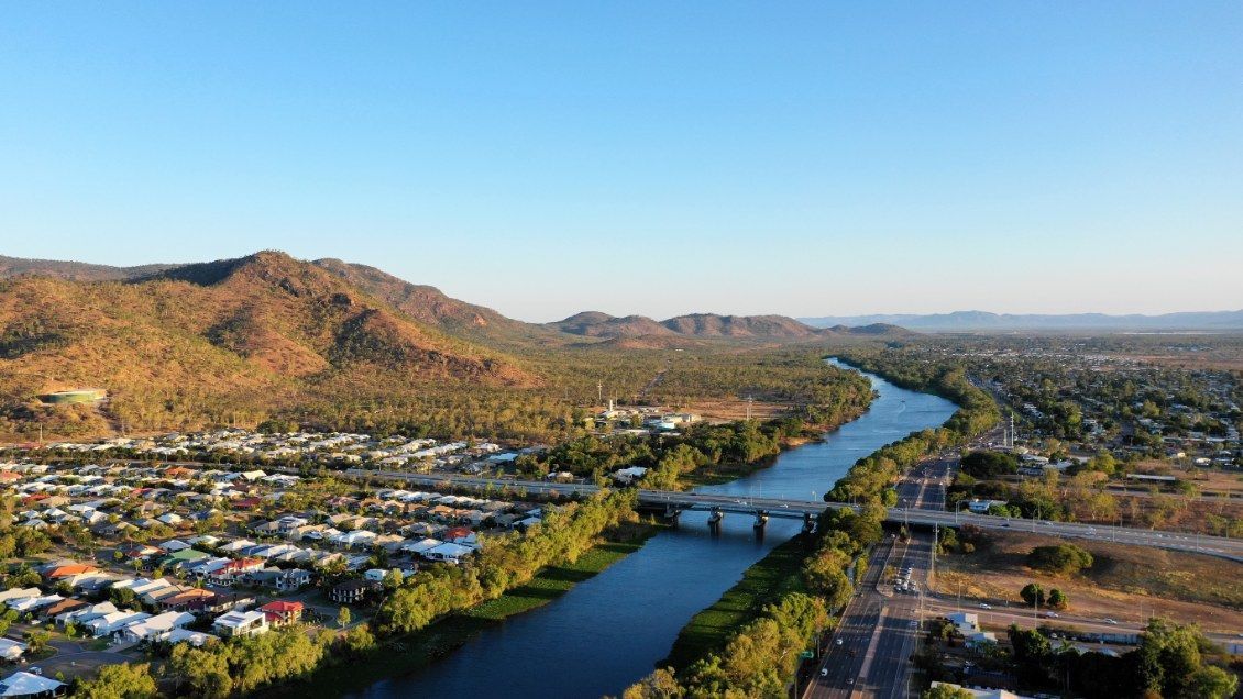 River Flowing Through a Town — All Grind & Coat in Tablelands, QLD