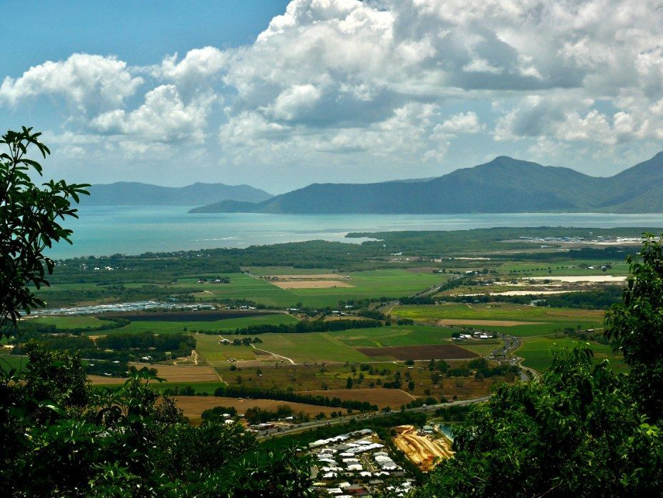 Green Landscape Overlooking a Bay With Mountains — All Grind & Coat in Port Douglas, QLD
