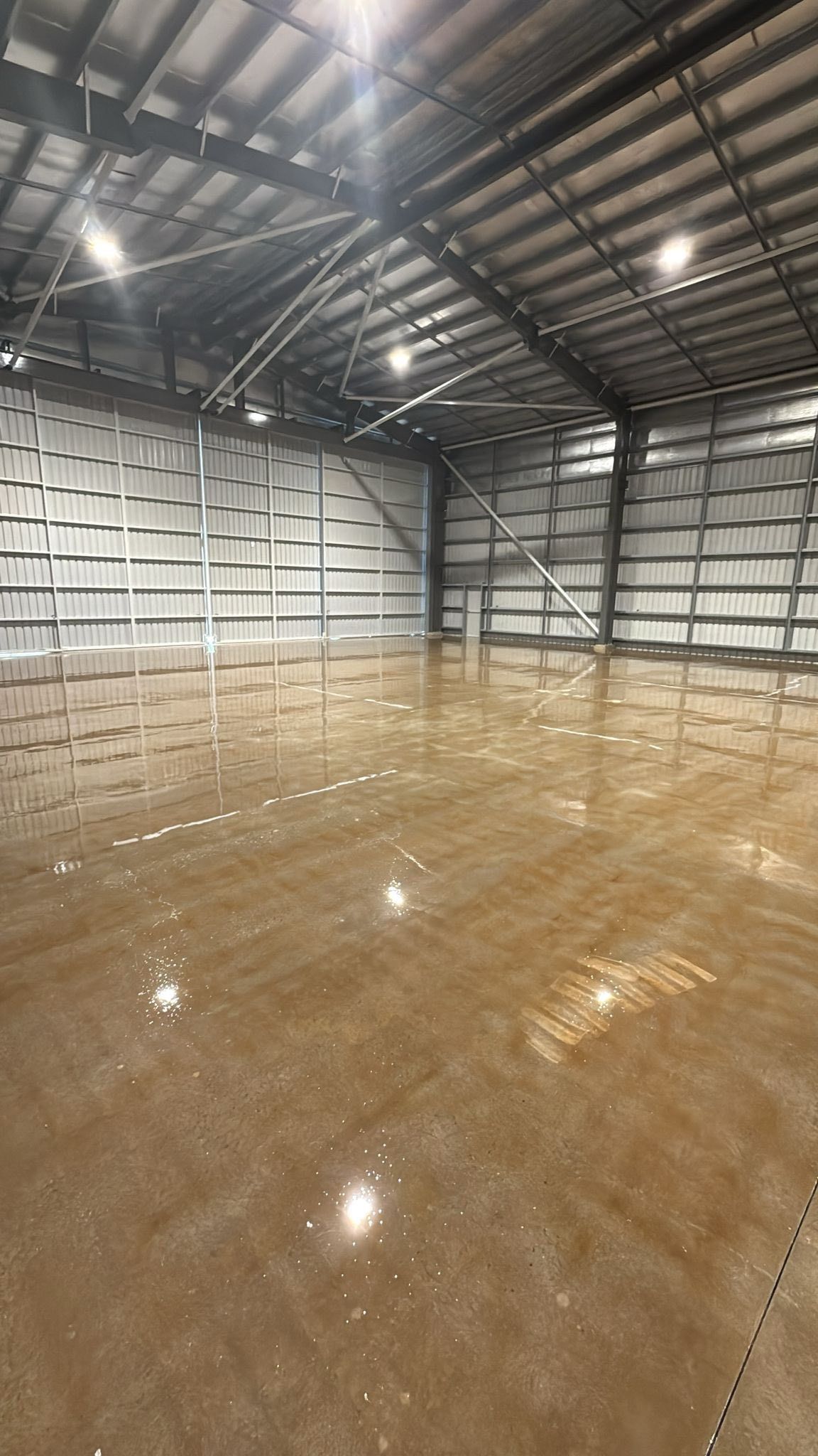 Empty Warehouse With Polished Concrete Floors — All Grind & Coat in Cairns, QLD