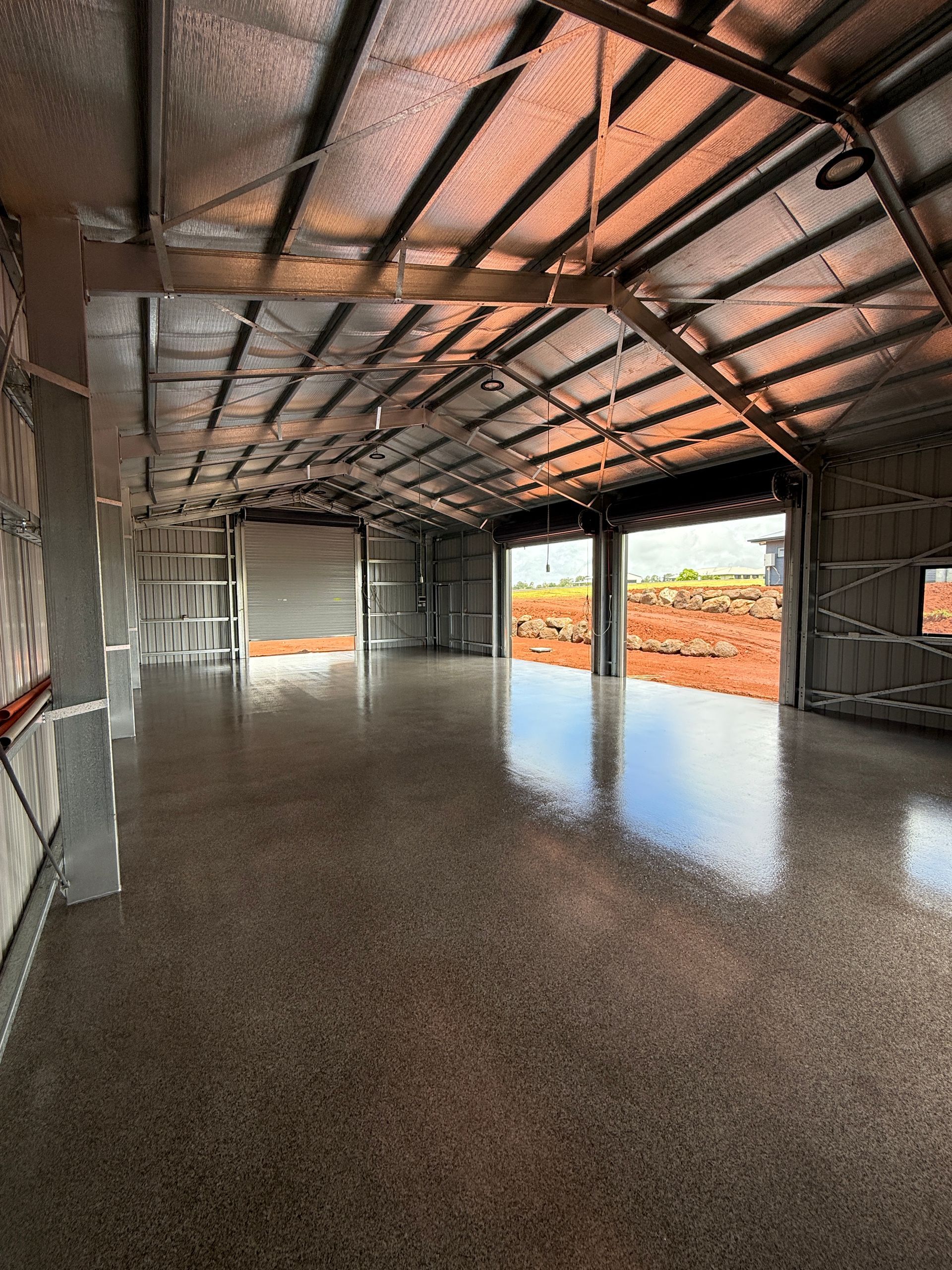 Inside of a New Construction Steel Building With Reflective Roof — All Grind & Coat in Cairns, QLD