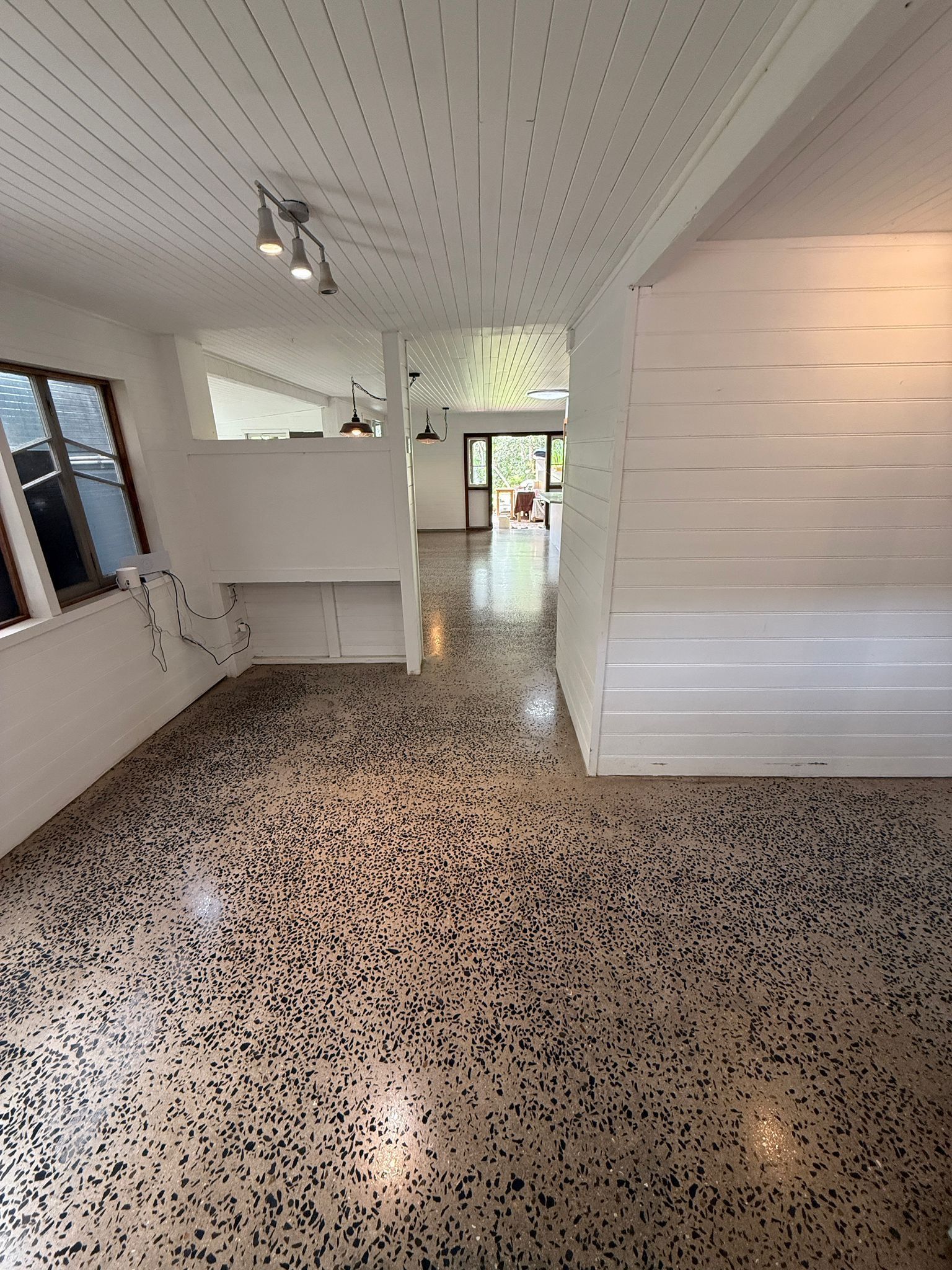 Empty Bright Room With White Walls, Speckled Terrazzo Floor — All Grind & Coat in Cairns, QLD