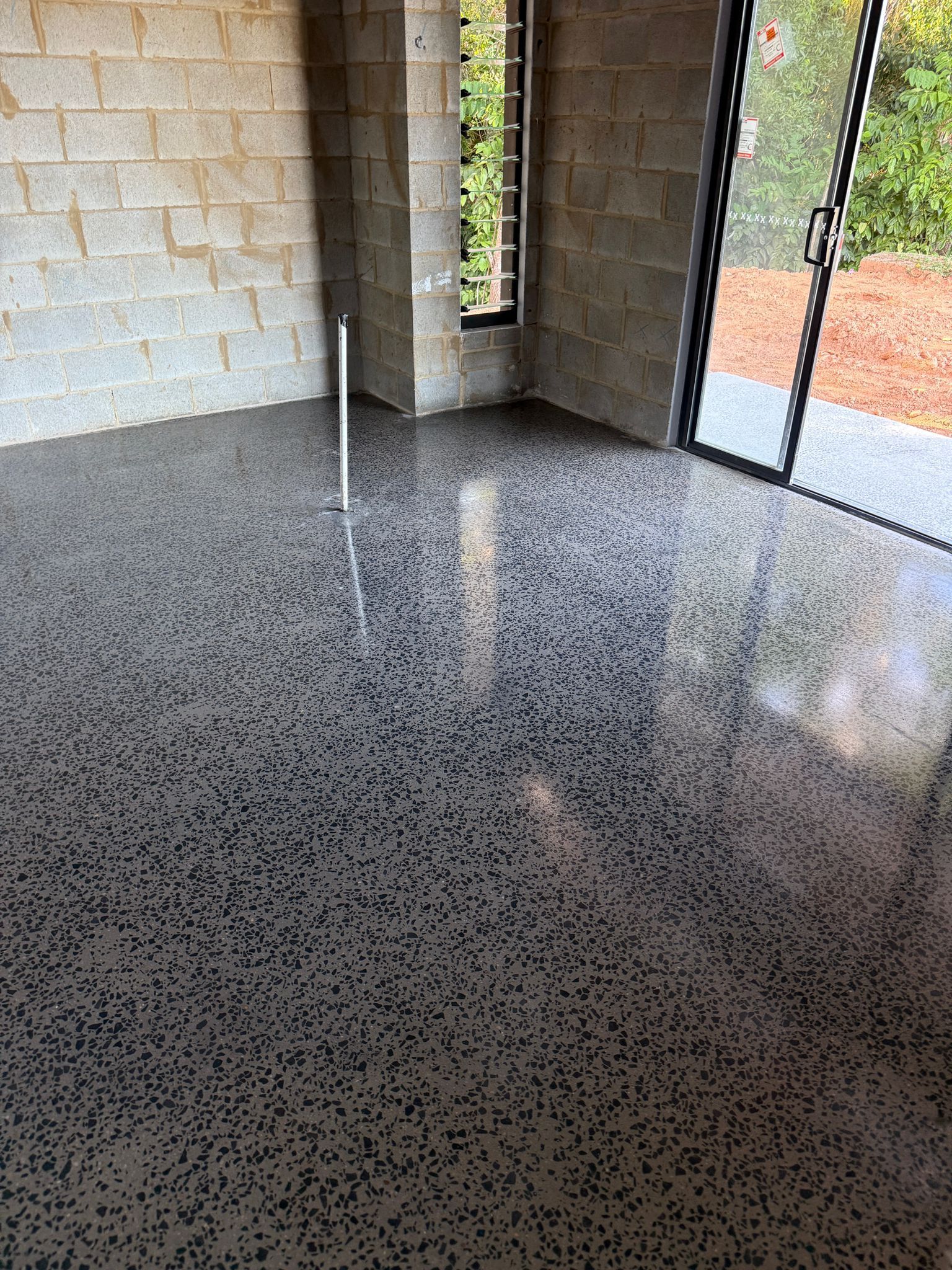 Empty Speckled Concrete Room — All Grind & Coat in Cairns, QLD