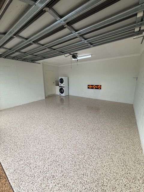 A Garage With a Washer and Dryer in It — All Grind & Coat in Cairns, QLD