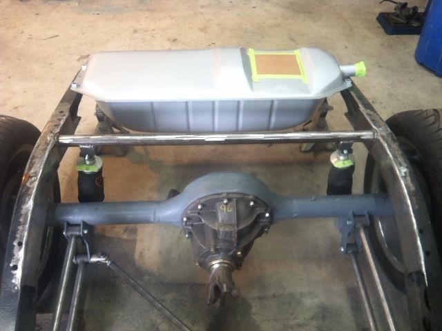 A metal frame with a fuel tank on top of it