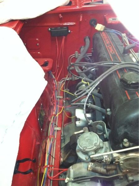 A red car with a mitsubishi engine