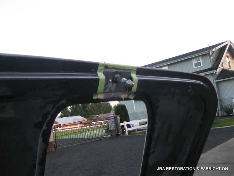 A picture of a car hood that says jra restoration & cad cat on it