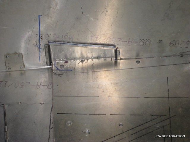 A close up of a piece of metal that says jra restoration on it