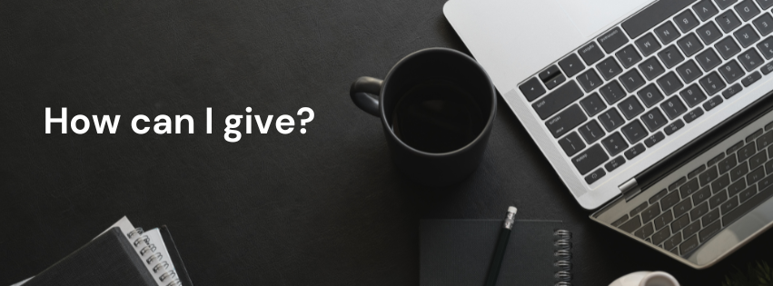 Desk with laptop, coffee mug, notebook, and “How can I give?” text on the left