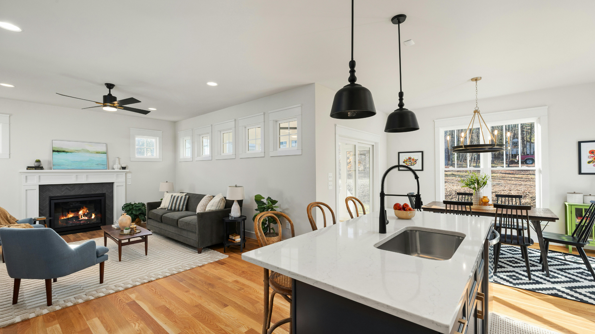 Modern wood kitchen with island, built-in appliances, and warm recessed lighting