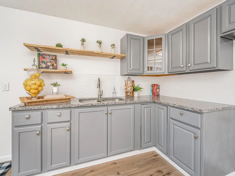 Completed kitchen renovations with custom solid wood shelves.