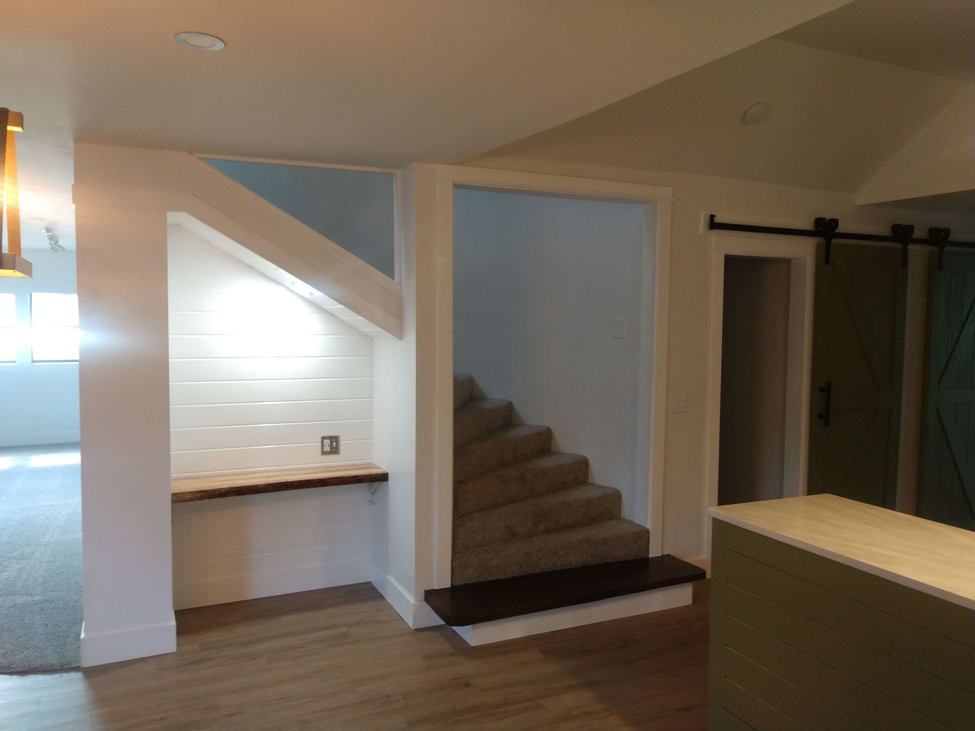 Living/Dining Interior with Custom Wood Shelving and Alcove with Custom Desk