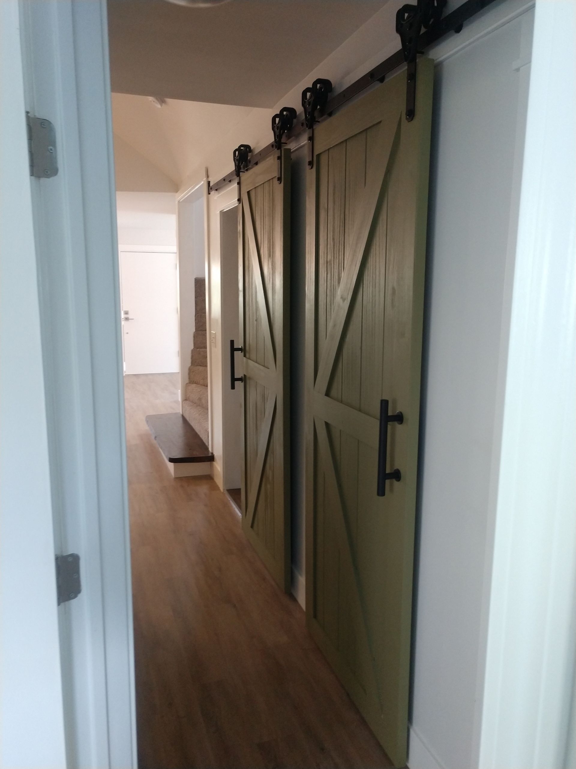 Matching sliding doors in vintage farmhouse style.