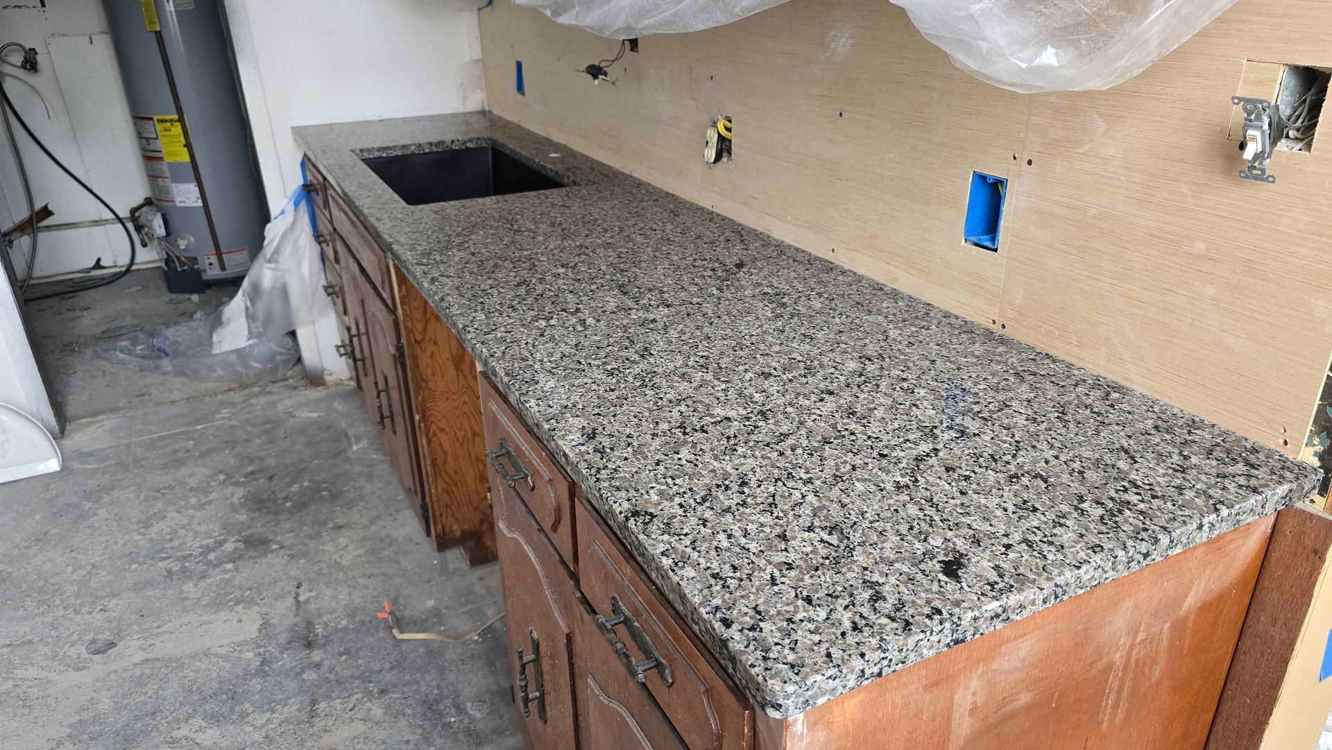 Black Mottled Countertop Installed by Professionals at Vogts' Contracting