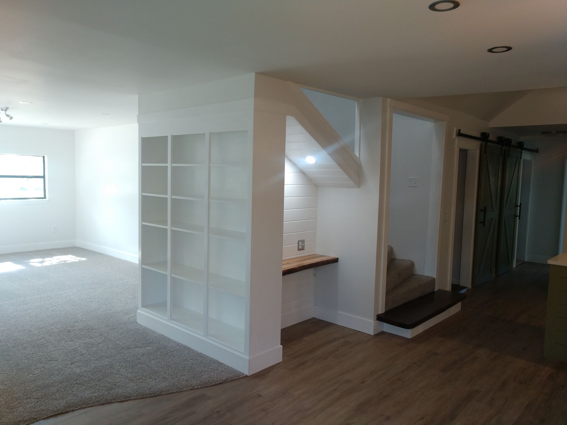 Custom wood shelving and accents in living room done by an experienced handyman